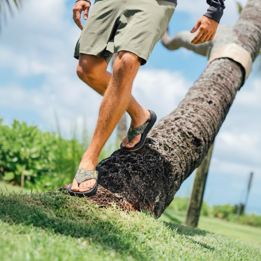 The man is wearing PCSsole Army Green Camo Flip Flops